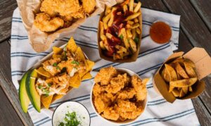 How to make chicken strips? Chicken strips served with chips, gravy and avocado