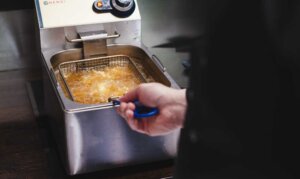 Frying Fish Nuggets in a Restaurant Kitchen