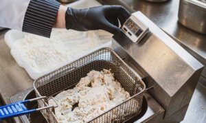 Holly Powder marinating and breading system The Holly Powder breading method simplifies chicken preparation
